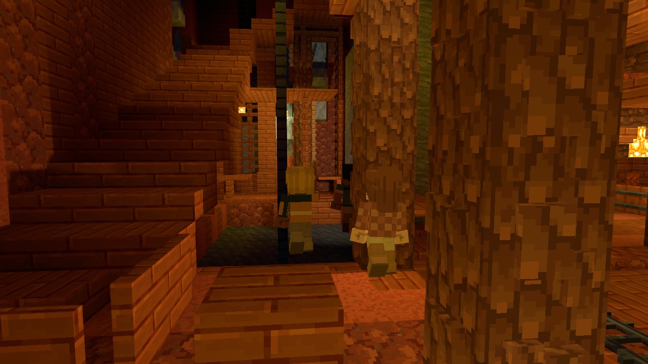 Timber-framed tunnels and walkways inside an old mine, lit by lanterns.